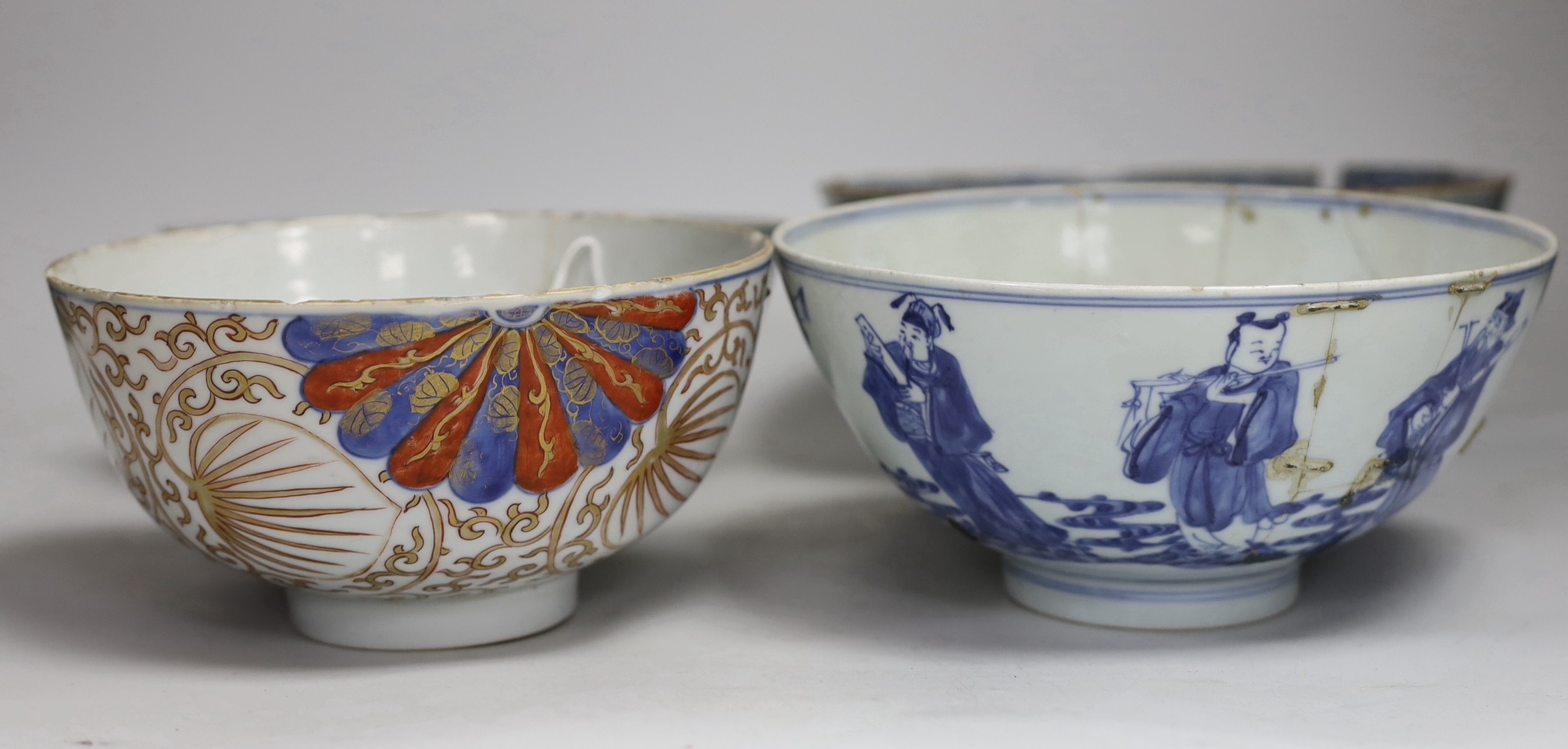 Four 18th century Chinese bowls, one painted in underglaze blue with the eight immortals, with six character Qianlong seal mark and of the period, largest 24cm diameter